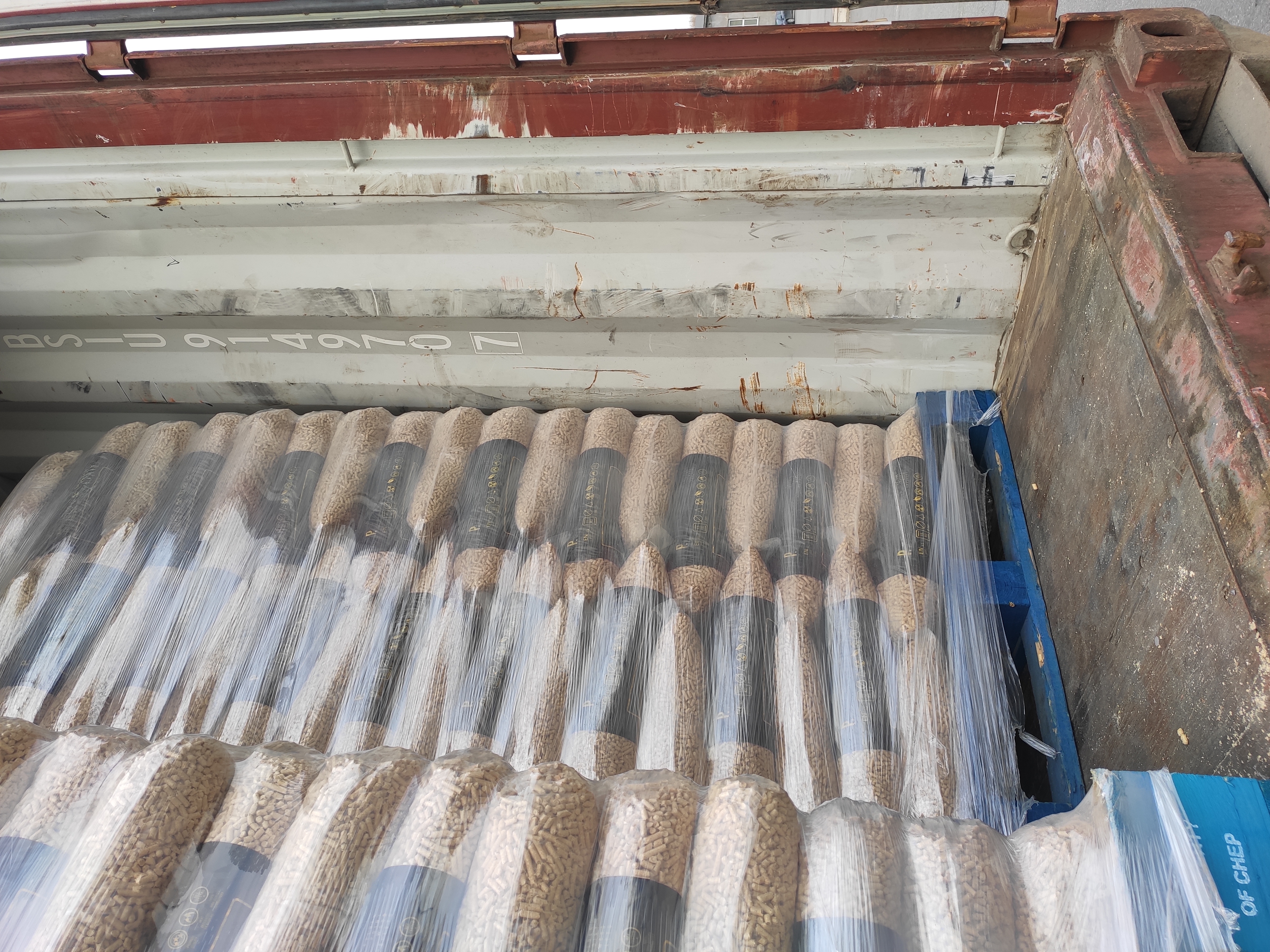Palletized pellet bags loaded into container
