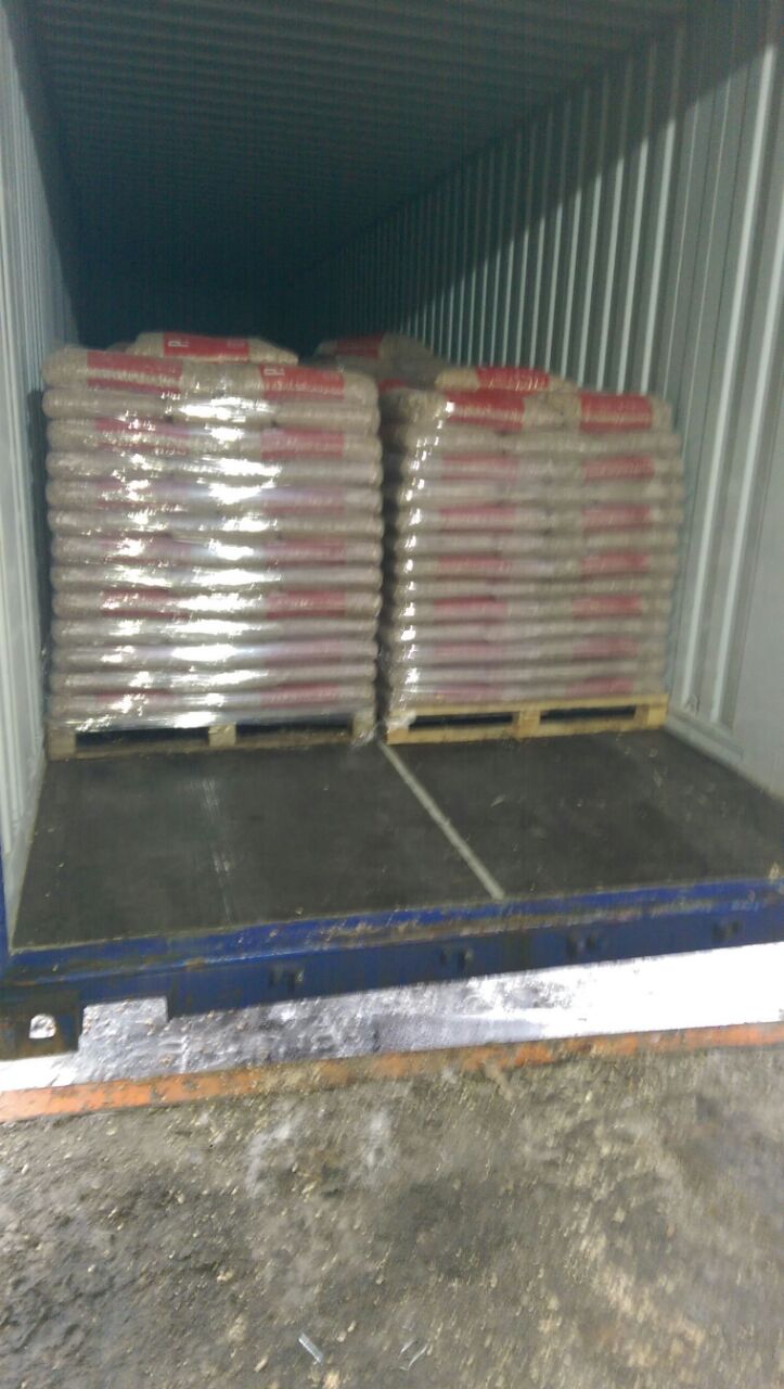 Pallets with pellet bags inside container